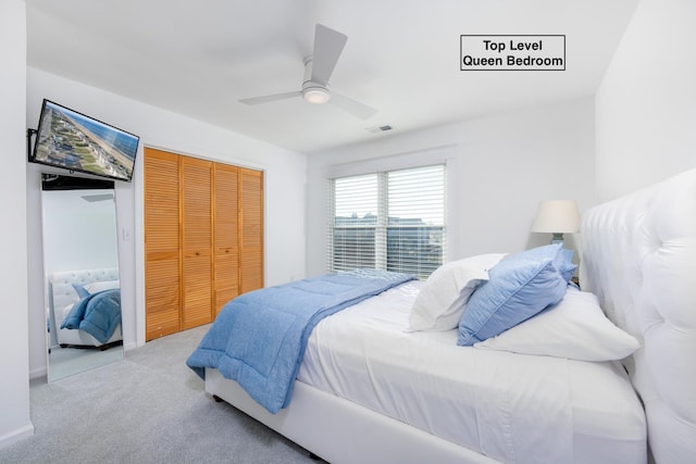 carpeted bedroom featuring visible vents and ceiling fan