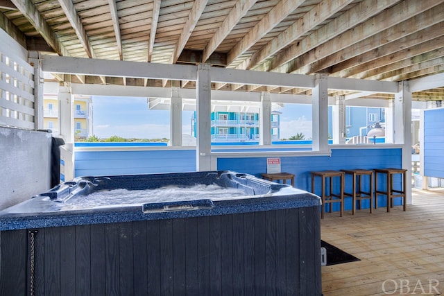 view of patio with a wooden deck and a hot tub