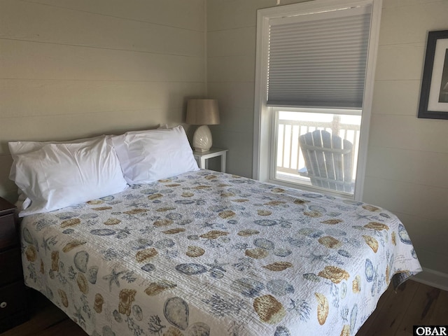 bedroom with wood finished floors