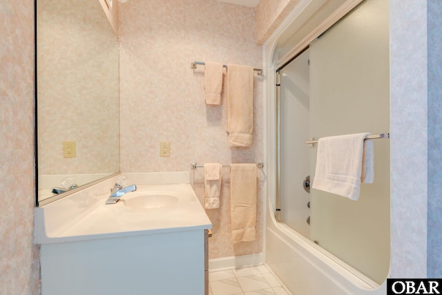 full bathroom with wallpapered walls, vanity, baseboards, and enclosed tub / shower combo