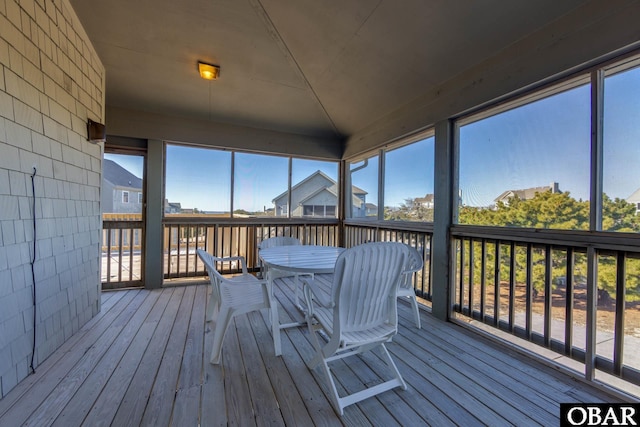 wooden deck featuring outdoor dining area