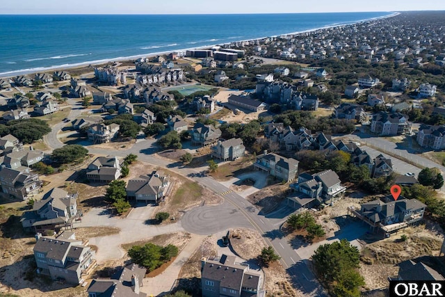 birds eye view of property with a residential view, a view of the beach, and a water view