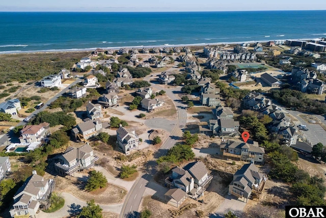 birds eye view of property featuring a residential view, a water view, and a view of the beach