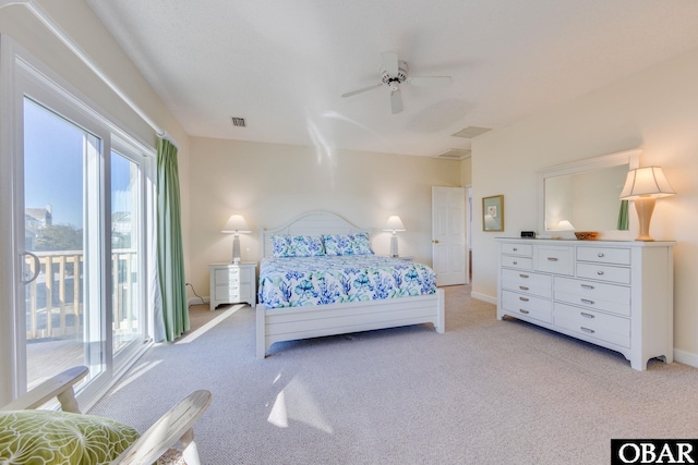 bedroom featuring access to exterior, baseboards, light carpet, and ceiling fan