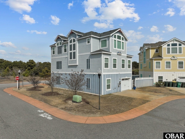 view of front of home featuring an attached garage and board and batten siding