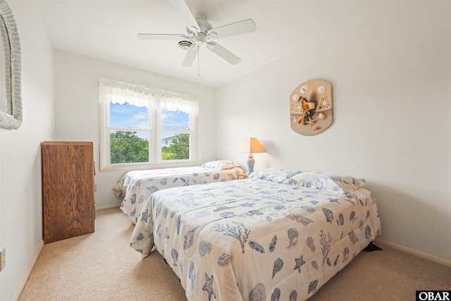 2201 Sandpiper Rd Lot # 13, Corolla, NC 27927 - carpeted bedroom featuring baseboards and ceiling fan