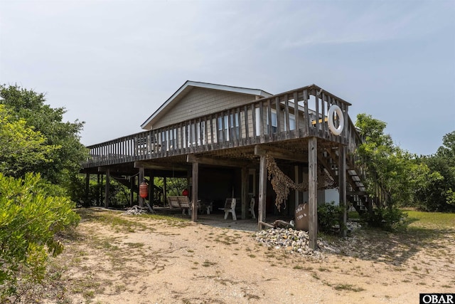 2201 Sandpiper Rd Lot # 13, Corolla, NC 27927 - rear view of house featuring a deck and stairway