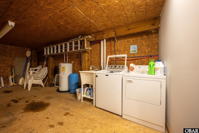 2201 Sandpiper Rd Lot # 13, Corolla, NC 27927 - laundry area featuring washer and clothes dryer and water heater