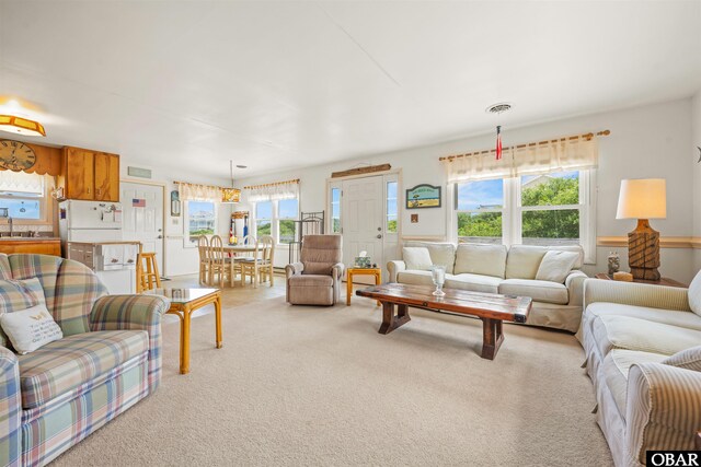 2201 Sandpiper Rd Lot # 13, Corolla, NC 27927 - living area featuring light carpet