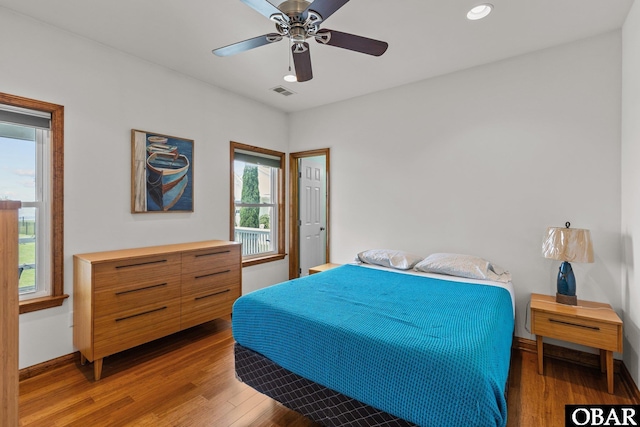 102 E Point Estates Ct Lot 2, Knotts Island, NC 27950 - bedroom with wood finished floors, baseboards, a ceiling fan, and recessed lighting