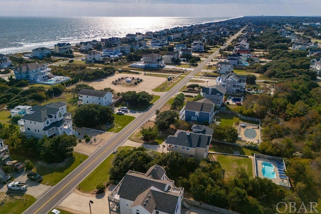 birds eye view of property with a water view and a residential view