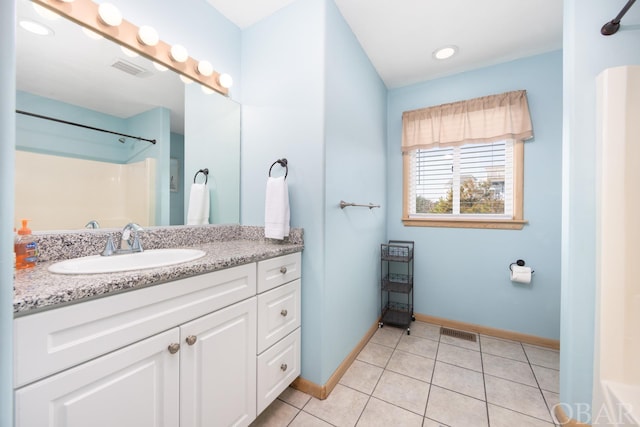 bathroom featuring tile patterned flooring, visible vents, baseboards, and vanity