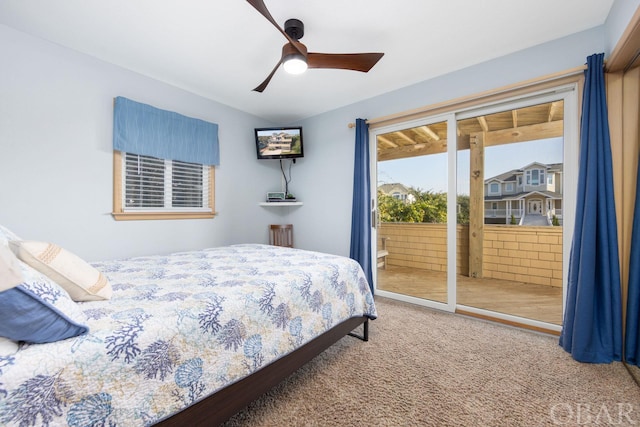 carpeted bedroom featuring access to exterior and ceiling fan