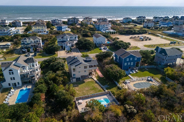 bird's eye view with a water view and a residential view