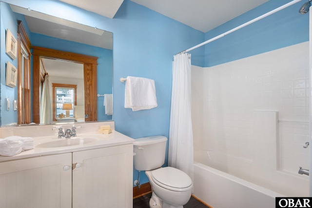 bathroom with toilet, shower / tub combo, and vanity