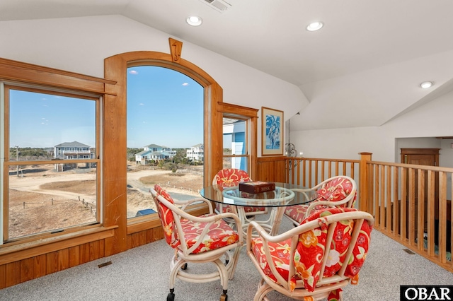 dining space with carpet floors, lofted ceiling, and recessed lighting