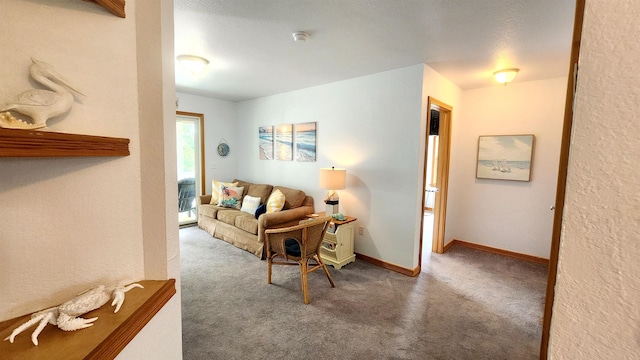 carpeted living room featuring baseboards