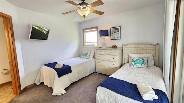 bedroom featuring carpet floors, baseboards, and a ceiling fan