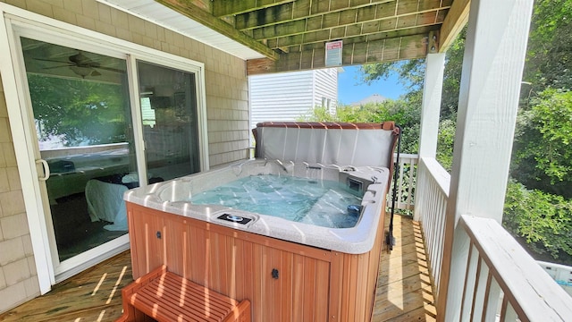 wooden terrace with a hot tub