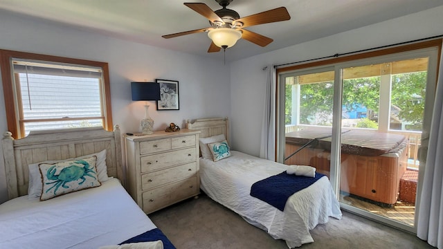 bedroom with access to exterior, dark carpet, and ceiling fan