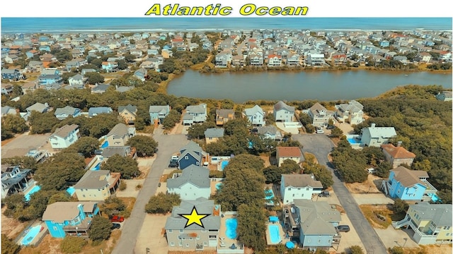 aerial view with a water view and a residential view