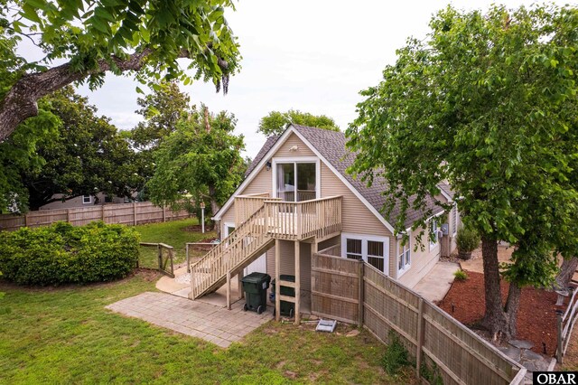 1115 Waterlily Rd, Coinjock, NC 27923 - back of house with a patio area, stairs, a shingled roof, and a deck