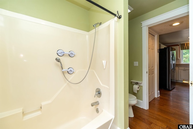 1115 Waterlily Rd, Coinjock, NC 27923 - full bathroom with shower / bath combination, wood finished floors, and recessed lighting