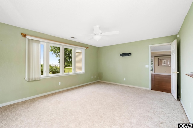 1115 Waterlily Rd, Coinjock, NC 27923 - unfurnished room featuring carpet floors and a ceiling fan