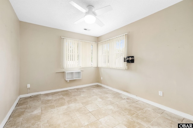 1115 Waterlily Rd, Coinjock, NC 27923 - spare room featuring ceiling fan and a textured ceiling
