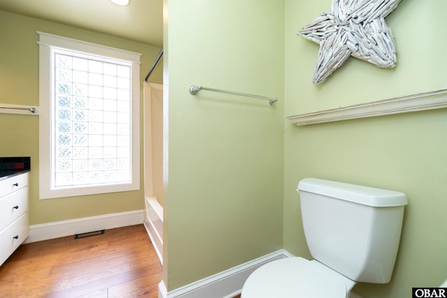 1115 Waterlily Rd, Coinjock, NC 27923 - bathroom with hardwood / wood-style flooring, vanity, shower / washtub combination, and recessed lighting