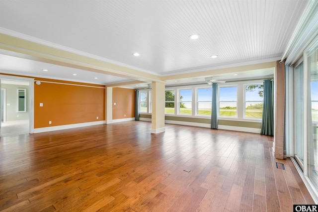 1115 Waterlily Rd, Coinjock, NC 27923 - unfurnished living room with ornate columns, ornamental molding, wood finished floors, and recessed lighting