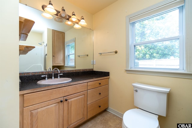 1115 Waterlily Rd, Coinjock, NC 27923 - bathroom featuring healthy amount of natural light, vanity, and tile patterned floors