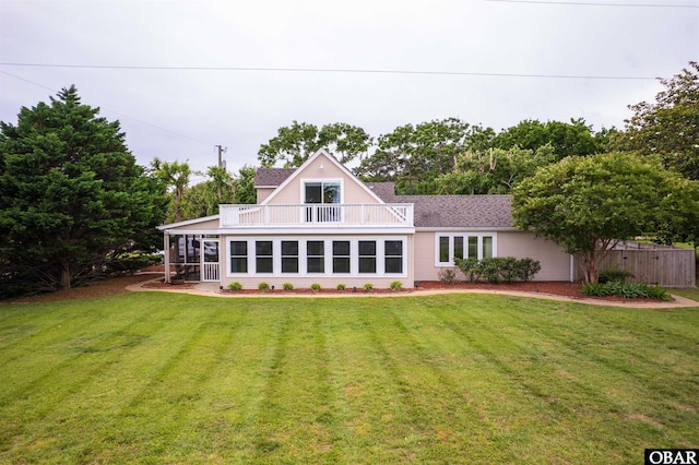 1115 Waterlily Rd, Coinjock, NC 27923 - back of house featuring a balcony, a yard, and a sunroom