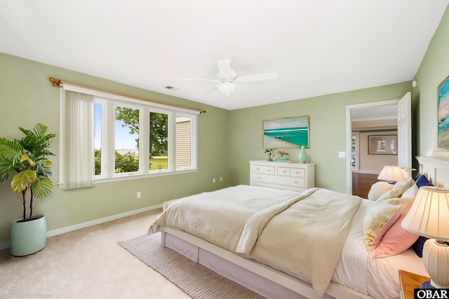 1115 Waterlily Rd, Coinjock, NC 27923 - bedroom with carpet flooring and ceiling fan