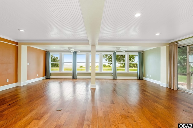 1115 Waterlily Rd, Coinjock, NC 27923 - unfurnished living room featuring crown molding, plenty of natural light, hardwood / wood-style flooring, recessed lighting, and a ceiling fan