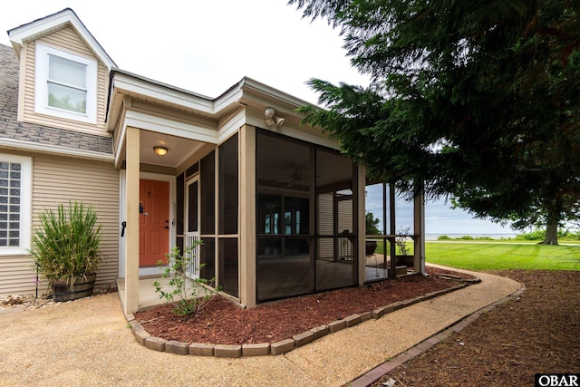 1115 Waterlily Rd, Coinjock, NC 27923 - view of exterior entry with ceiling fan