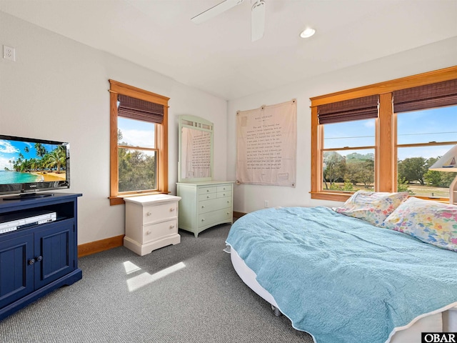 bedroom featuring carpet flooring, a ceiling fan, and baseboards