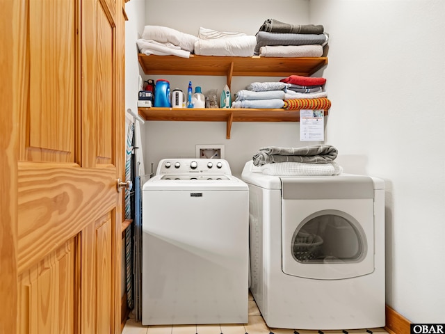 laundry room featuring independent washer and dryer and laundry area