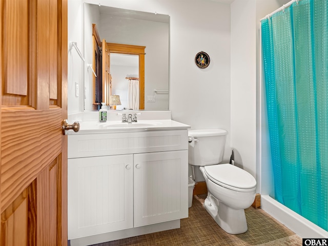 full bathroom featuring tile patterned floors, curtained shower, toilet, and vanity