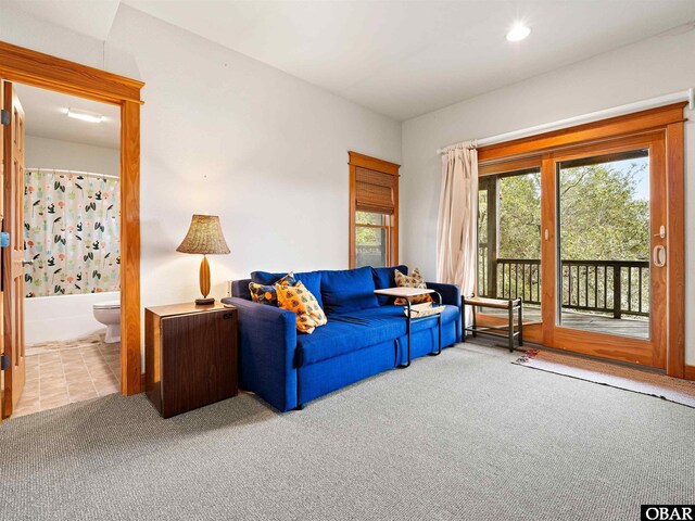 living area featuring carpet floors and recessed lighting