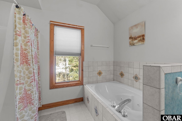 bathroom featuring lofted ceiling, a jetted tub, tile patterned flooring, and baseboards