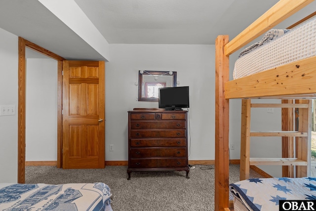 bedroom with carpet and baseboards