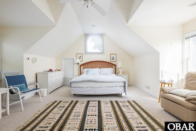 carpeted bedroom featuring baseboards, lofted ceiling, and a ceiling fan
