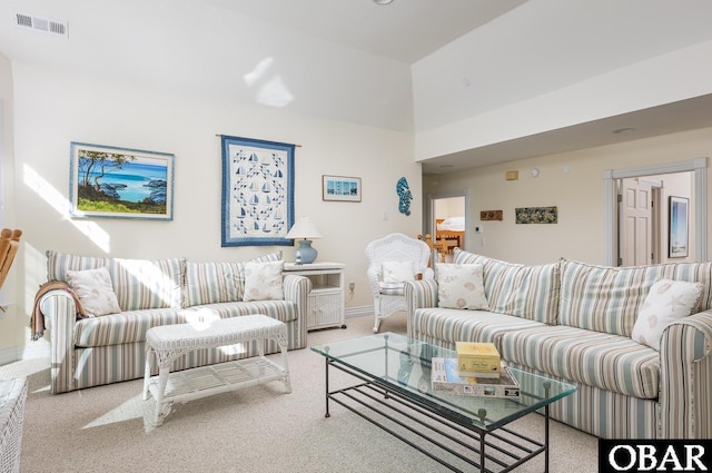 living area with light carpet and visible vents