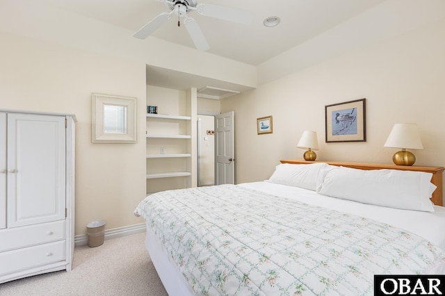 bedroom with light carpet, baseboards, and ceiling fan