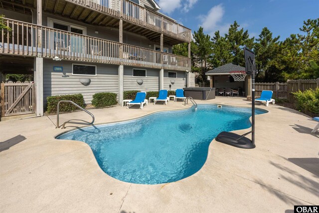 1024 Lighthouse Dr Lot 14, Corolla, NC 27927 - view of swimming pool featuring a hot tub, a patio, and a fenced backyard