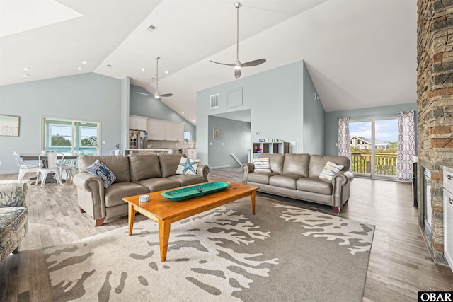 1024 Lighthouse Dr Lot 14, Corolla, NC 27927 - living area with high vaulted ceiling, light wood-style floors, a ceiling fan, healthy amount of natural light, and recessed lighting