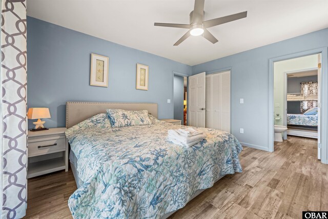 1024 Lighthouse Dr Lot 14, Corolla, NC 27927 - bedroom featuring wood finished floors, a closet, ensuite bath, and a ceiling fan