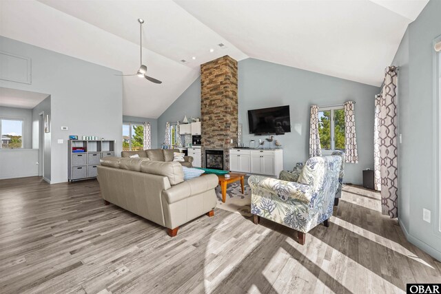 1024 Lighthouse Dr Lot 14, Corolla, NC 27927 - living area with wood finished floors, ceiling fan, high vaulted ceiling, and a fireplace