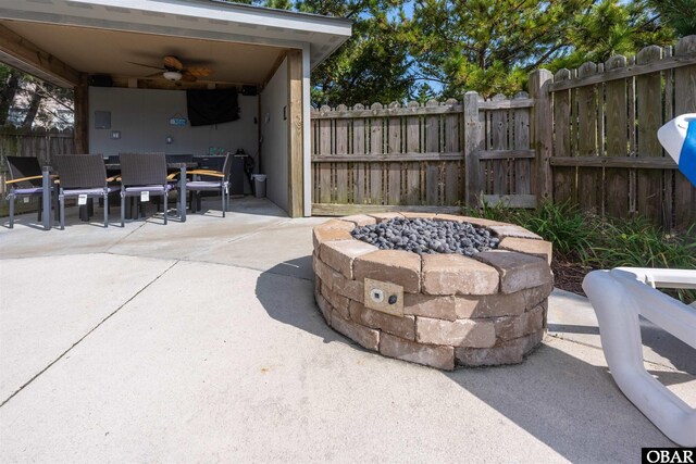 1024 Lighthouse Dr Lot 14, Corolla, NC 27927 - view of patio / terrace with a fire pit, outdoor dining space, and a ceiling fan